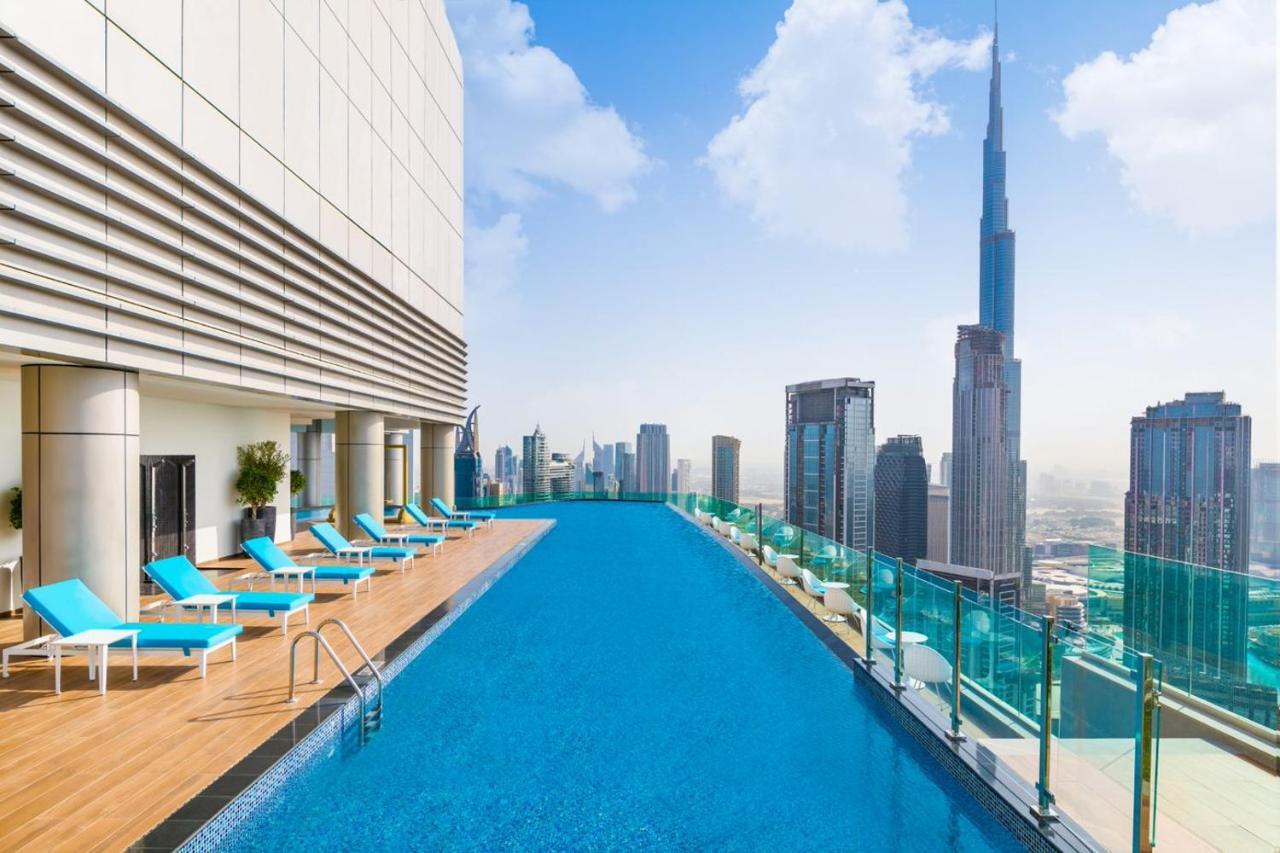 Paramount Hotel Midtown Dubai Exterior photo The swimming pool at the Address Downtown